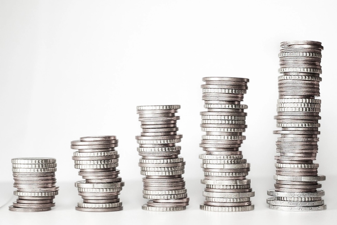 Stacks of coins representing income and rent qualification